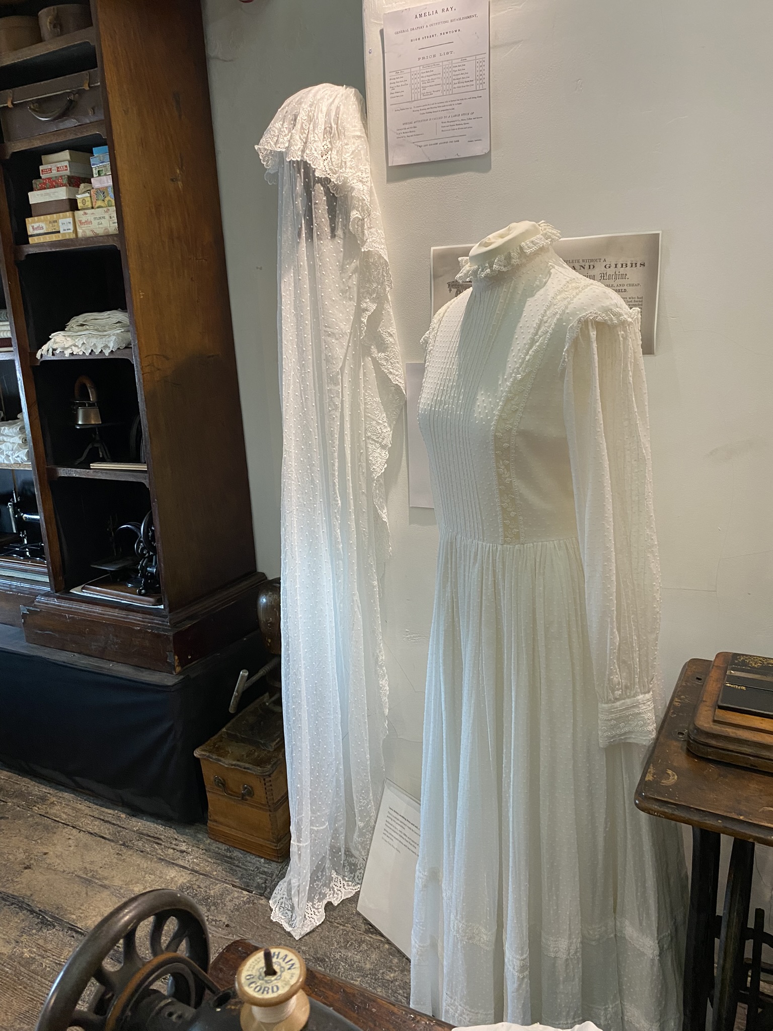 Wedding dress and veil on display