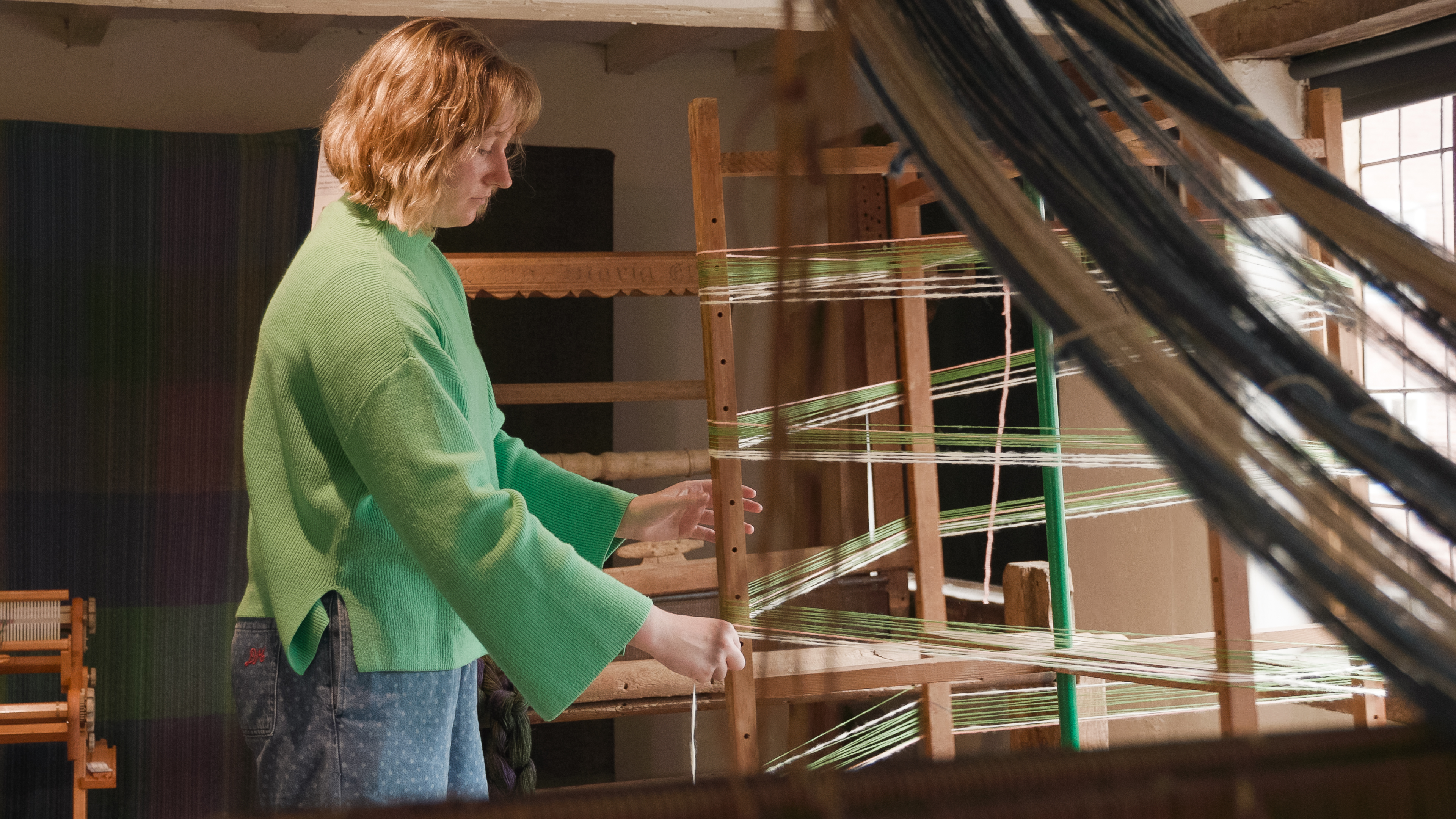 Rachel preparing the warp for the loom