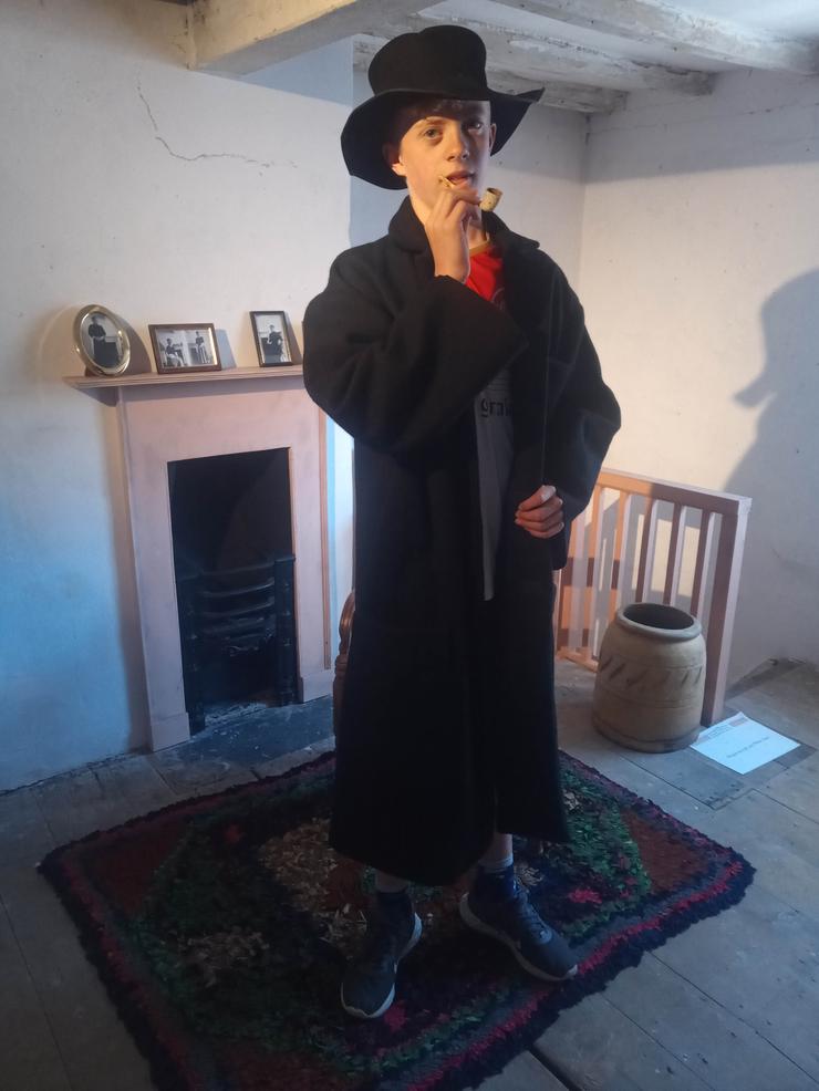 A young visitor dressed up as the Artful dodger